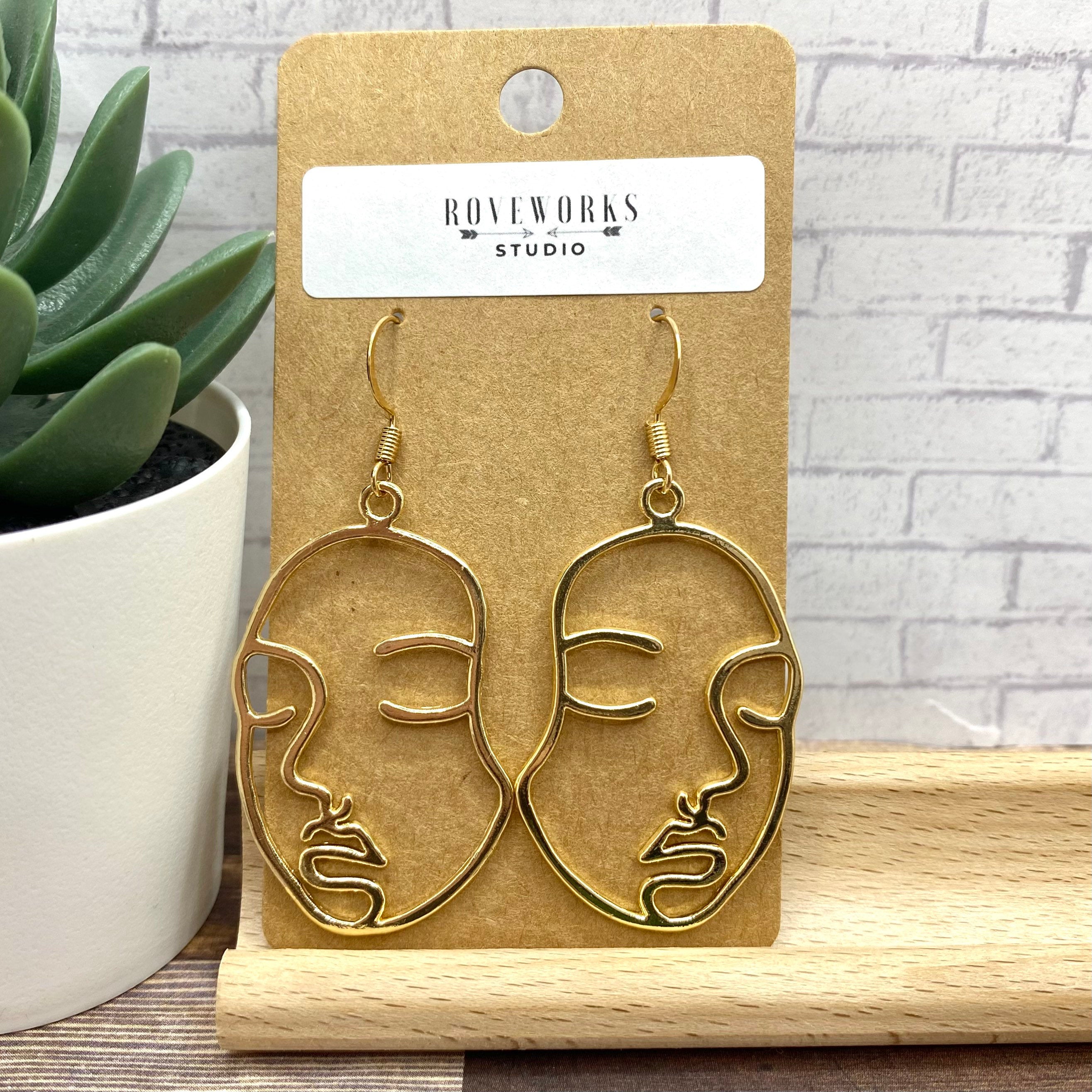 Gold abstract face deals earrings